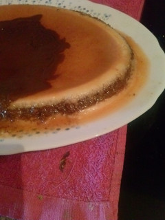 Una foto de Flan de coco, chocolate y naranja