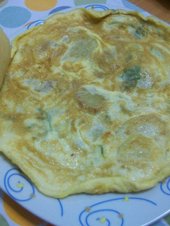 Una foto de Tortilla de patatas con toque al perejil