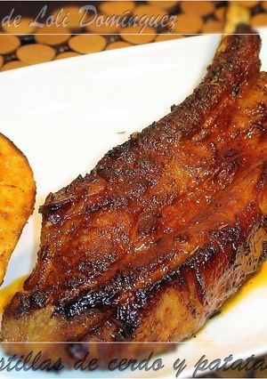 Una foto de Costillas de cerdo y patatas al horno