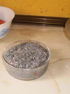 Una foto de Arroz negro con sepia y nata