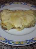 Milanesa con cebolla caramelizada y mozzarella