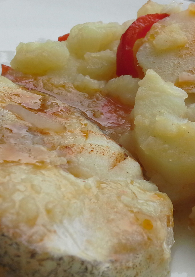 Una foto de Bacalao con pimientos