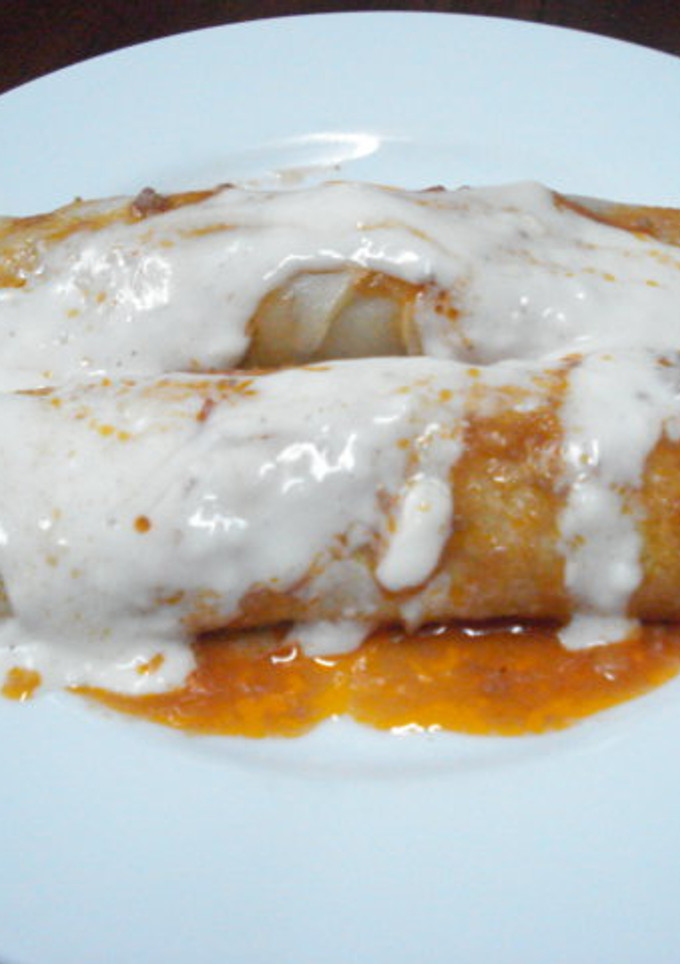 Una foto de Canelones de carne con salsa bechamel