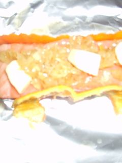 Una foto de Salmón en papillote con salsa de mejjillón
