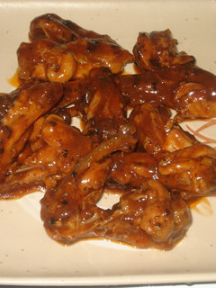 Una foto de Alitas de pollo borrachas en salsa de tamarindo