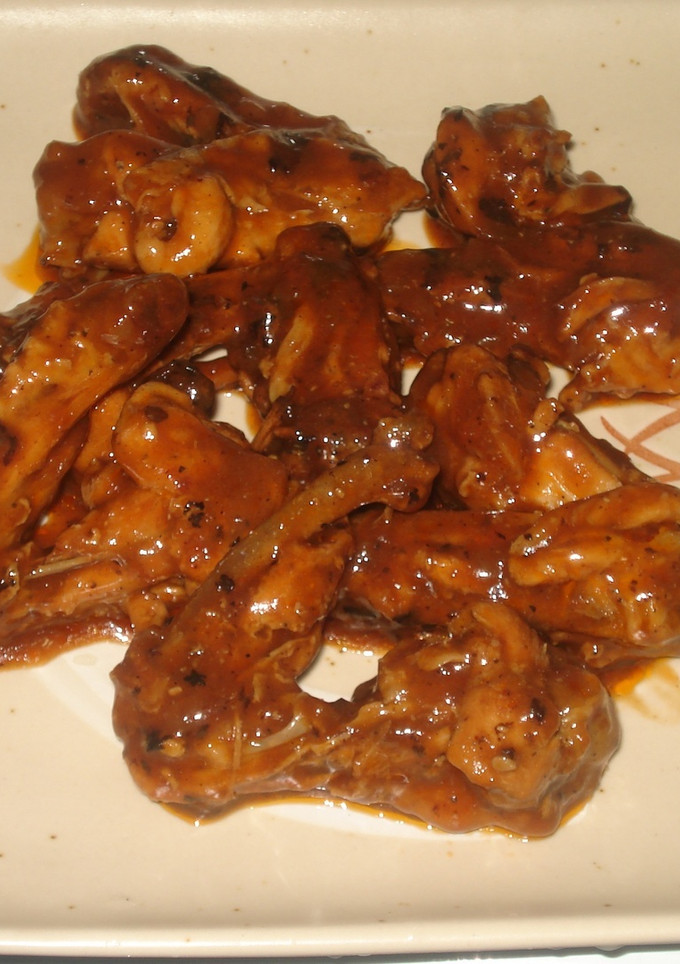 Una foto de Alitas de pollo borrachas en salsa de tamarindo
