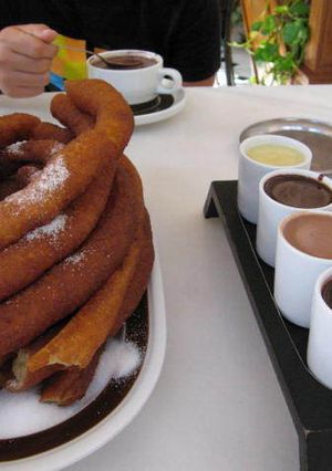 A picture of Chocolate with Churros.