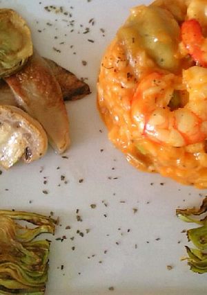 Una foto de Risotto de setas y gambas al curry