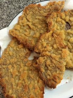 Una foto de Milanesas con papas fritas