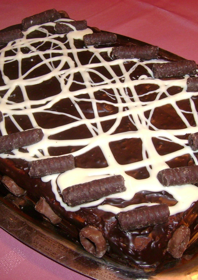 Una foto de Postre de chocolinas con queso crema y dulce de leche