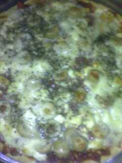 Una foto de Pizza casera con manteca