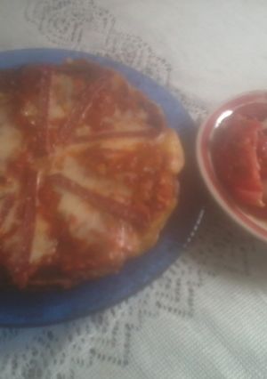 Una foto de Tortilla española a la pizza