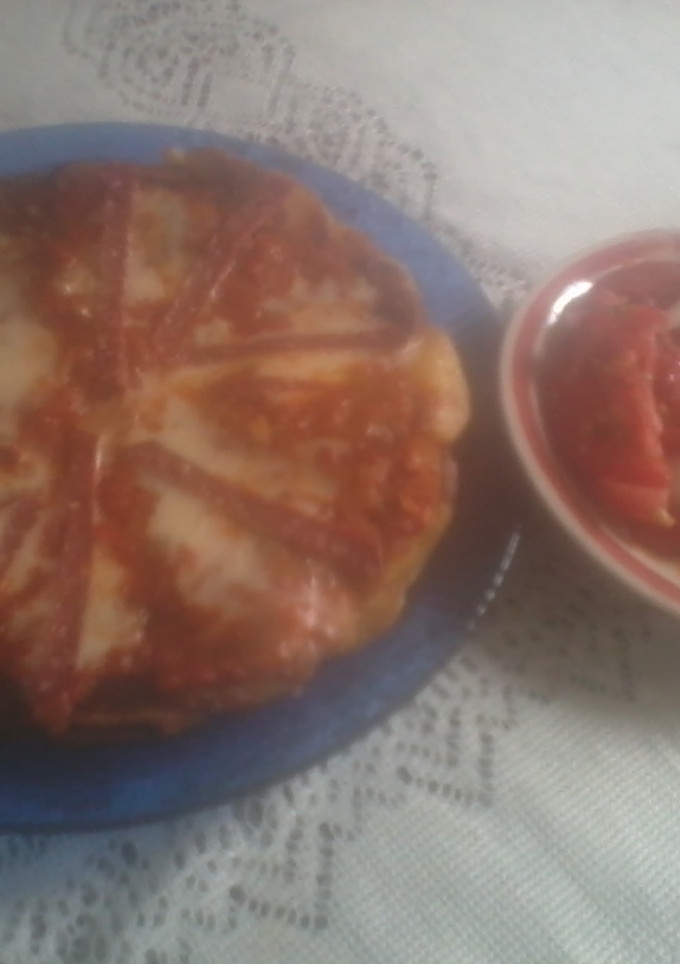 Una foto de Tortilla española a la pizza