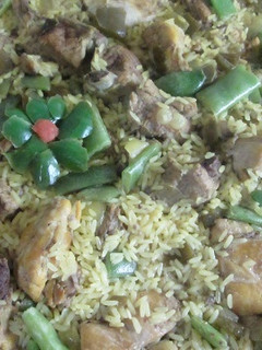Una foto de Arroz a la cerveza con carne mixta