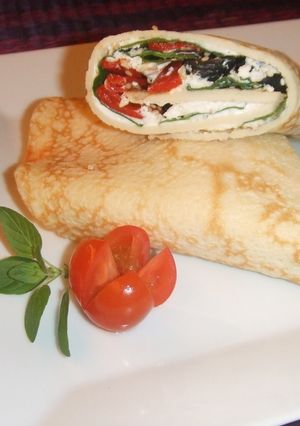 Una foto de Crepê nogada de espinacas y requesón