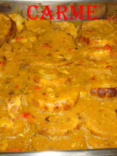 Una foto de Redondo de pavo relleno de bacon en salsa