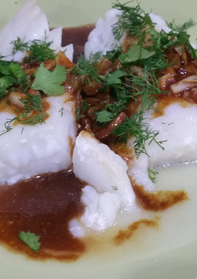 Una foto de Bacalao con ajitos, aliño y hierbas frescas
