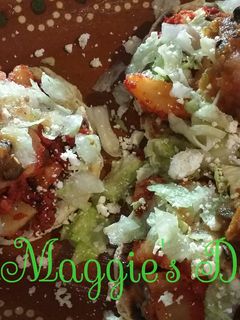 A picture of Sopes with Chorizo and Potato.
