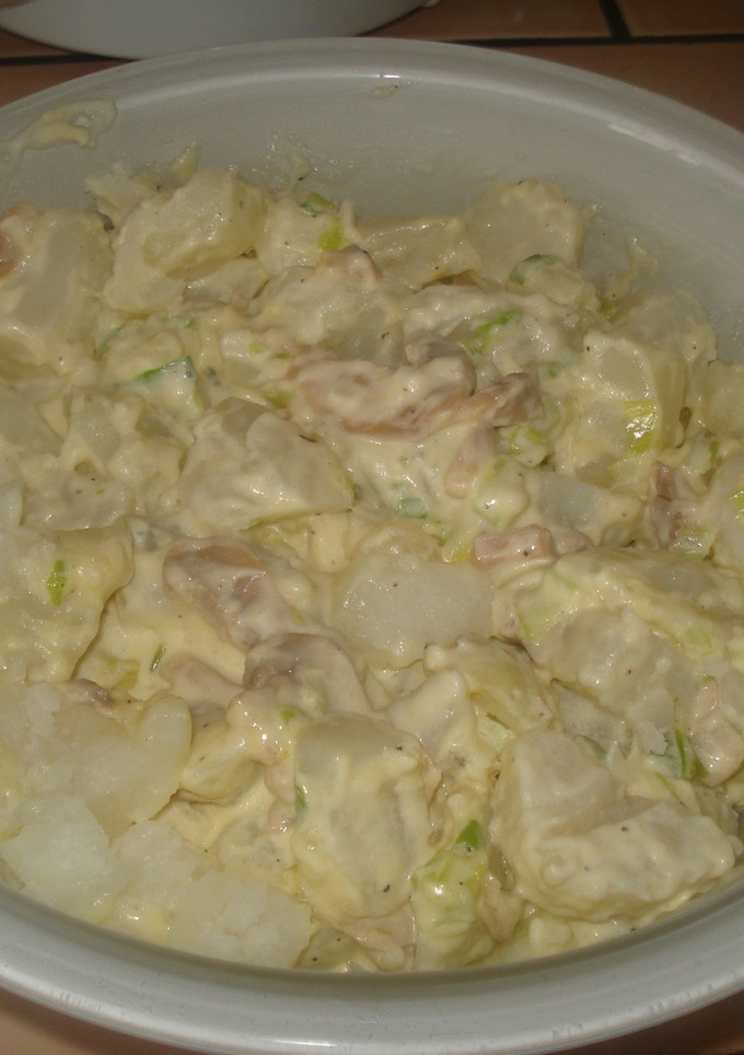 Una foto de Papas en salsa de queso crema