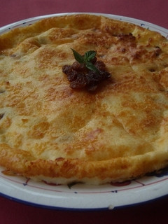 Una foto de Tarta de queso de Burgos, pasas y ron