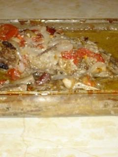 Una foto de Khorma de cordero con tomate