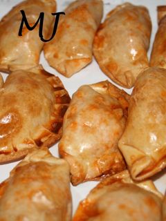 Una foto de Empanadas de pavo en salsa boloñesa