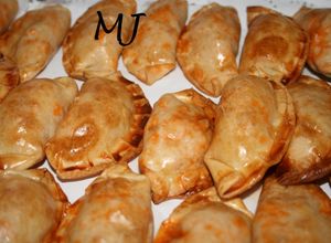 Una foto de Empanadas de pavo en salsa boloñesa