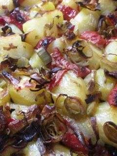 Una foto de Patatas con cebolleta al horno