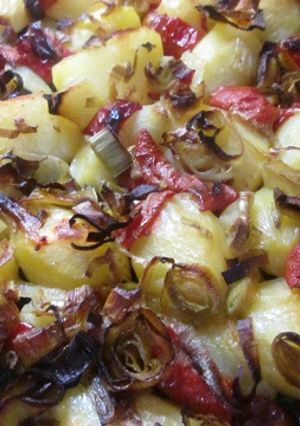 Una foto de Patatas con cebolleta al horno