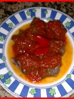 Una foto de Carne de cocido con tomate