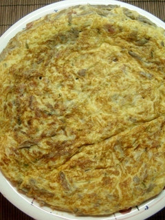 Foto principal de Tortilla de setas con jamón y queso fresco
