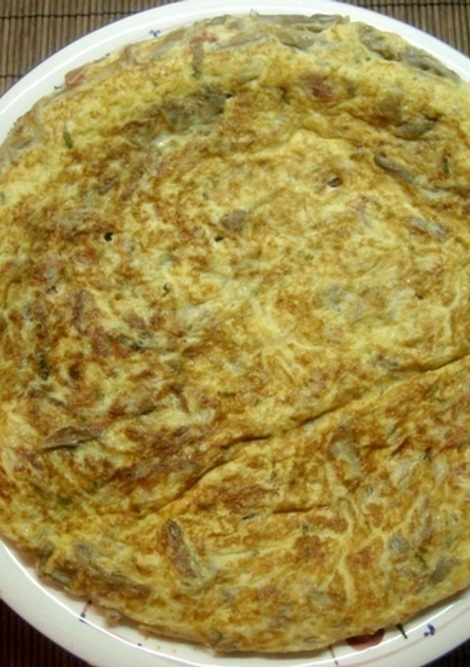 Una foto de Tortilla de setas con jamón y queso fresco