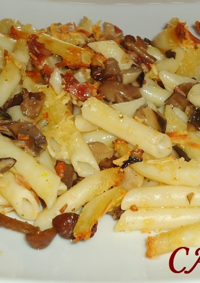 Una foto de Macarrones con setas al queso