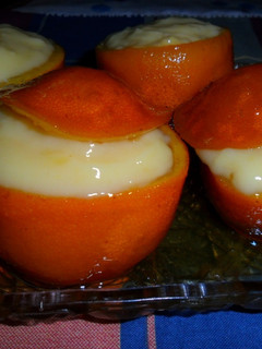 Una foto de Naranjas en almíbar rellenas de crema