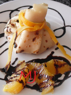 Una foto de Crêpes de naranja