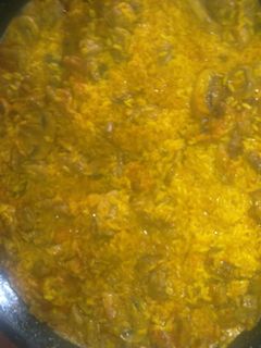Una foto de Arroz con lagartito iberico y champiñones