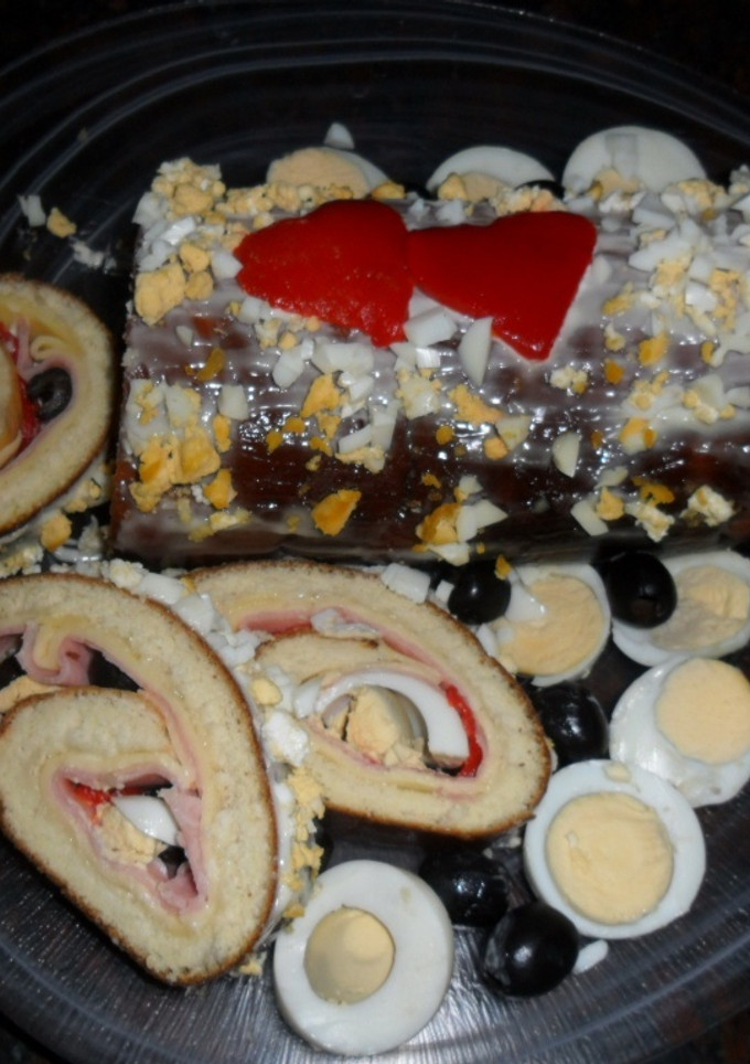 Una foto de Arrollado de pionono con jamón y queso