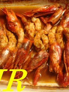 Una foto de Gambas o langostinos al Oporto