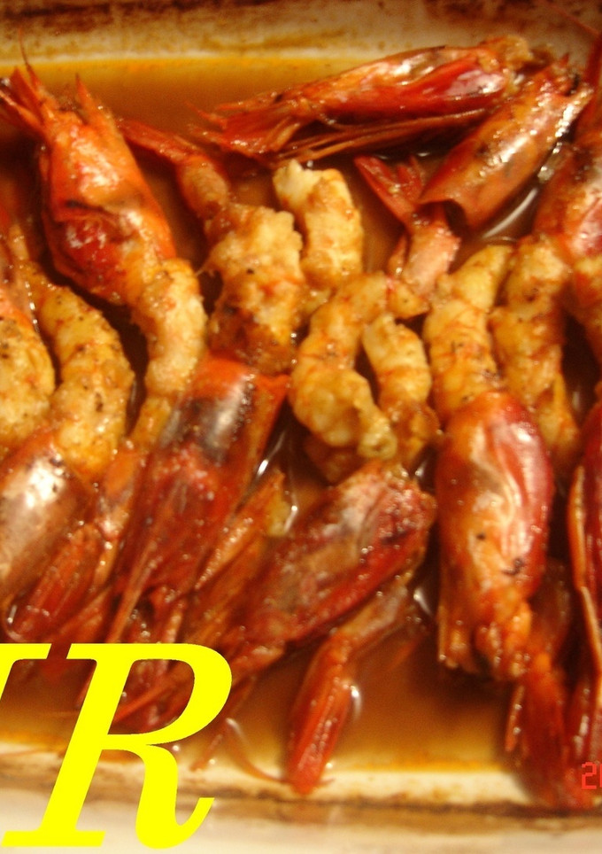 Una foto de Gambas o langostinos al Oporto