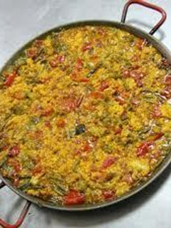Una foto de Arroz seco de bacalao con verduras