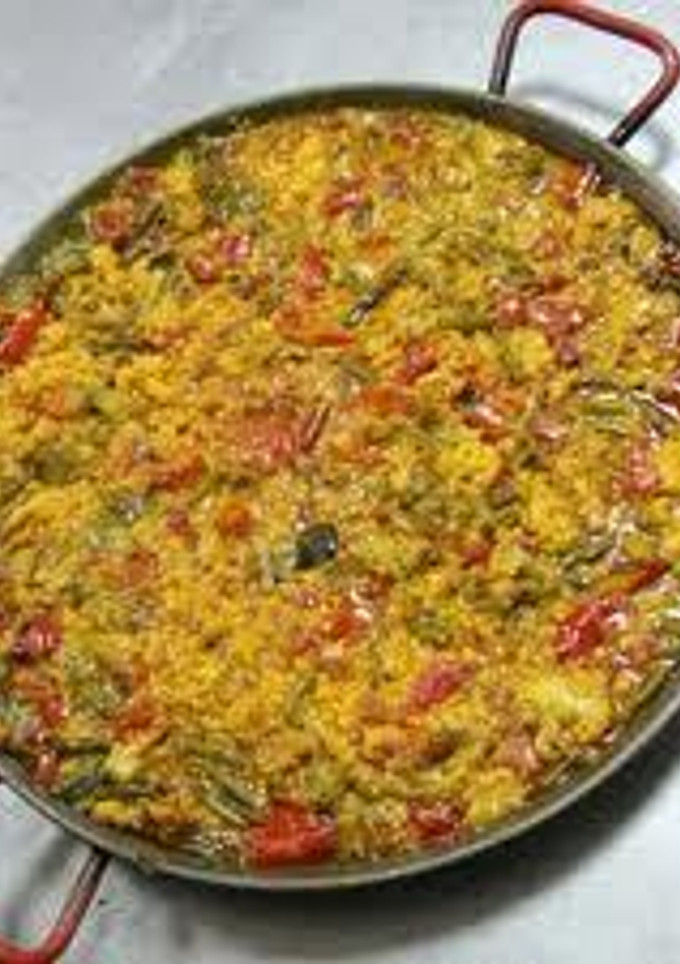 Una foto de Arroz seco de bacalao con verduras