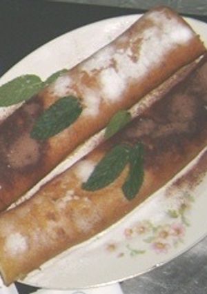 Una foto de Arrollado de ricota y chocolate
