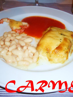 Una foto de Bacalao gratinado con langostinos y judías blancas