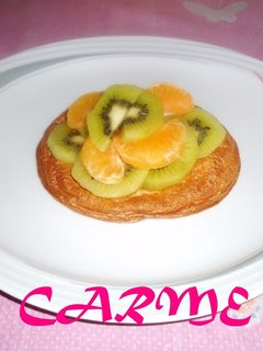 Una foto de Pavlova de kiwi