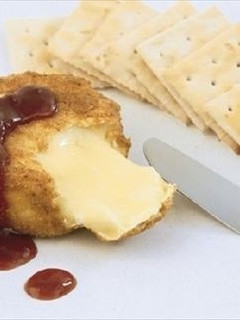 A picture of Breaded Camembert with Strawberry Sauce.