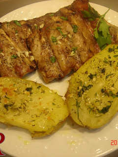 Una foto de Patatas al caliu