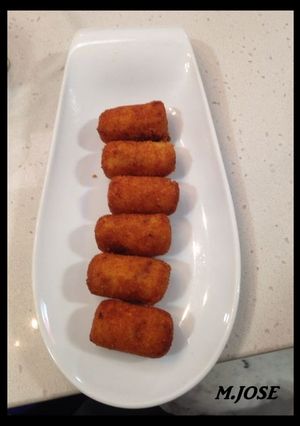 Una foto de Croquetas de chipirones en tinta