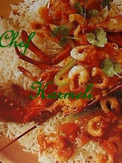 Una foto de Lubigante Relleno sobre Arroz Zuria y Gambas