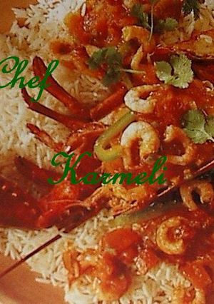 Una foto de Lubigante Relleno sobre Arroz Zuria y Gambas