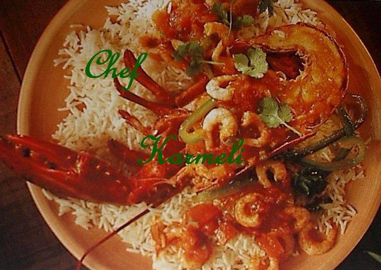 Lubigante Relleno sobre Arroz Zuria y Gambas